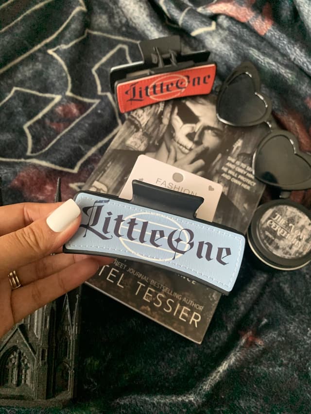 Little One bookish hair clips styled with a Shantel Tessier novel