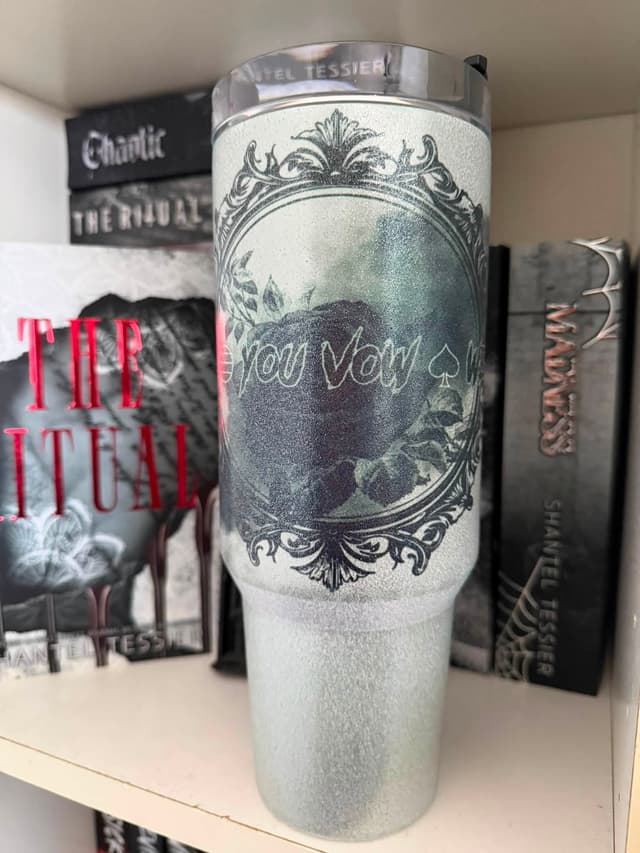 Sparkly 40oz tumbler with the I vow you vow we vow rose frame, styled with Shantel Tessier books
