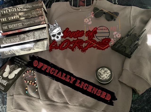 Taupe House of LORDS crewneck with a crowned skull and Shantel Tessier novels