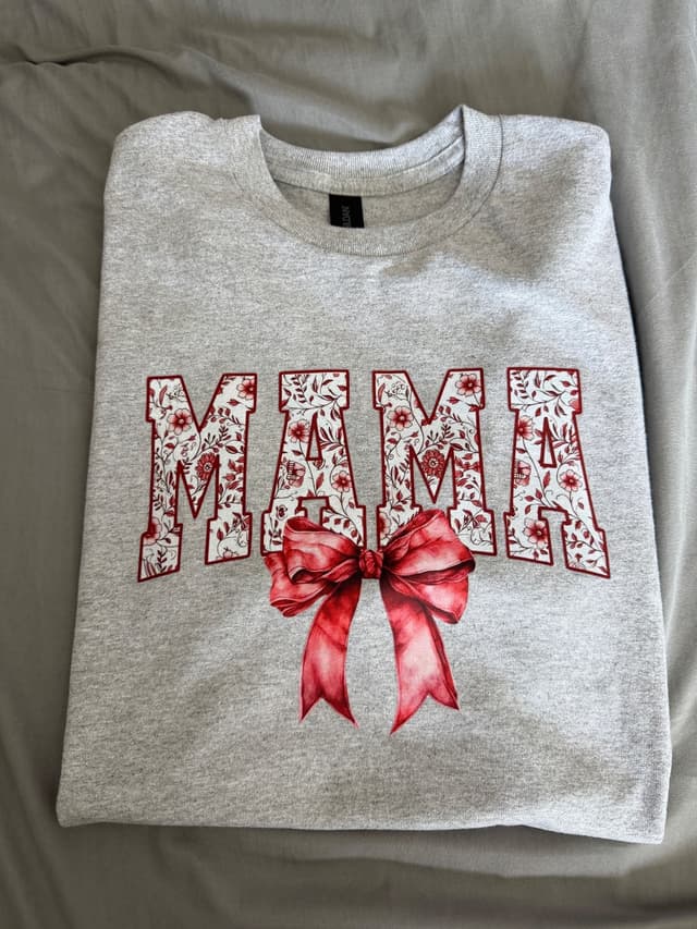 Heather gray MAMA tee with floral letters and a red bow